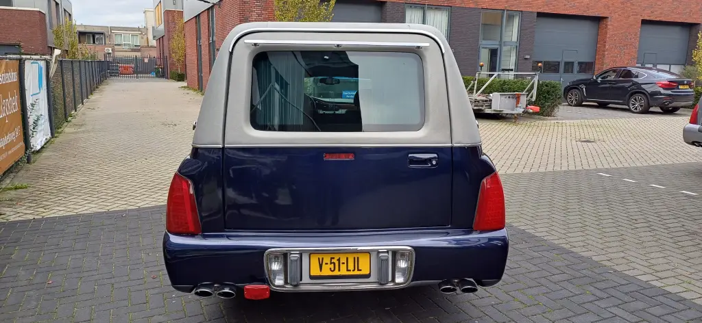 Cadillac blauwe rouwauto - foto 1